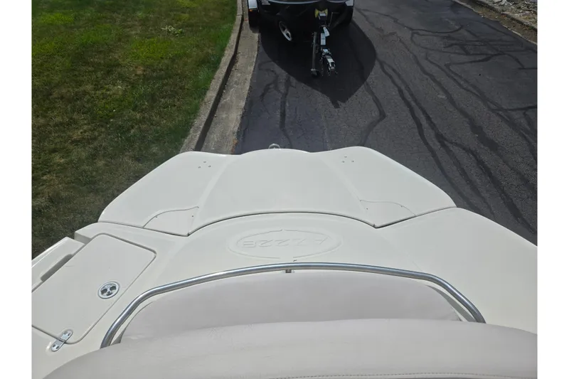Slide: The Image of Rear view of a 2007 Azure AZ228 boat on a trailer, parked on a driveway. - 26
