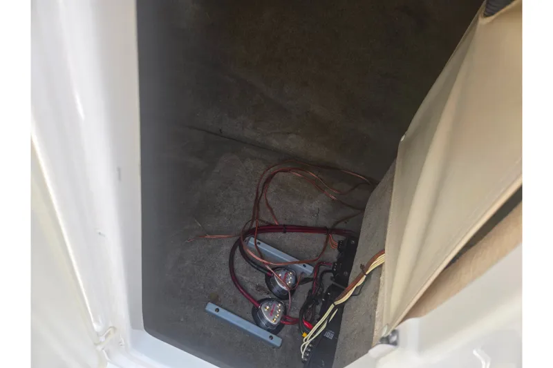 Slide: The Image of Interior view of a 2007 Azure AZ228 boat compartment with wiring and gauges. - 17