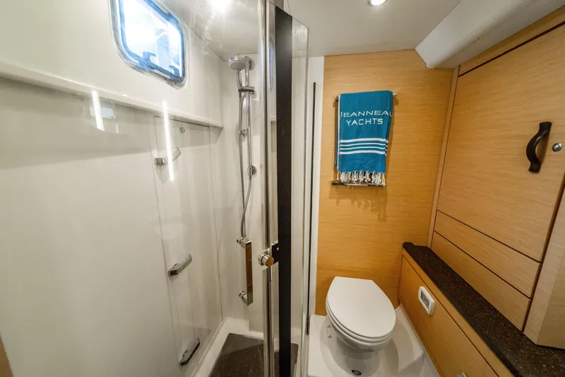 Slide: The Image of Luxurious bathroom in 2016 Jeanneau 64 yacht with shower and toilet. - 40