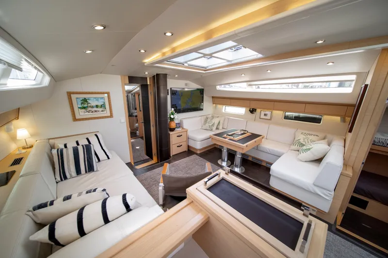 Slide: The Image of Luxurious interior of a 2016 Jeanneau 64 yacht with elegant seating and modern decor. - 26