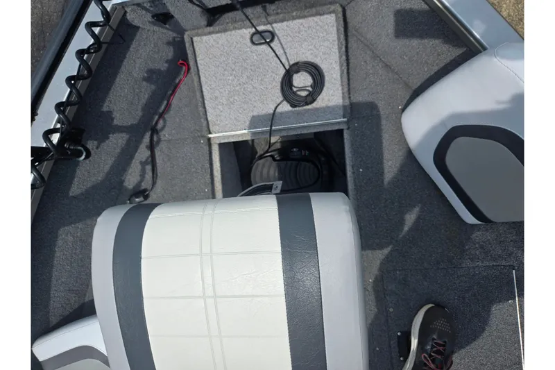 Slide: The Image of Interior of 2014 Crestliner 1650 Super Hawk boat with seating and storage area. - 20