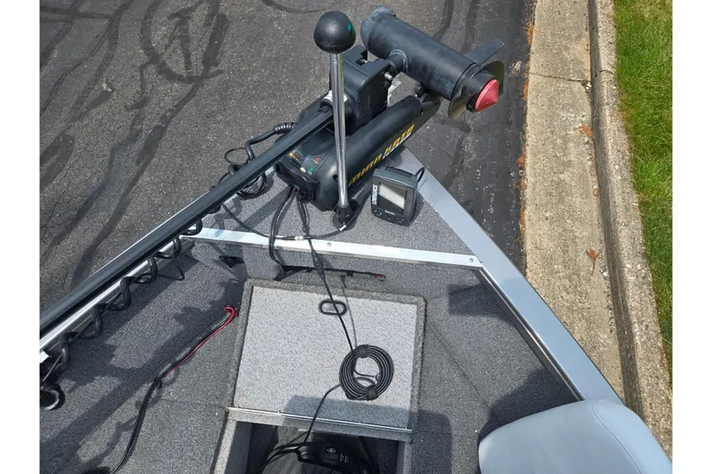 Slide: The Image of 2014 Crestliner 1650 Super Hawk boat with trolling motor and fish finder on deck. - 21