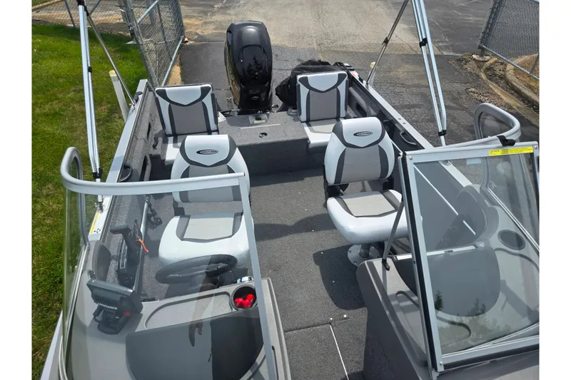 Slide: The Image of 2014 Crestliner 1650 Super Hawk boat interior with seating and steering console. - 23