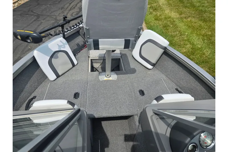 Slide: The Image of 2014 Crestliner 1650 Super Hawk boat interior with seating and storage compartments. - 18
