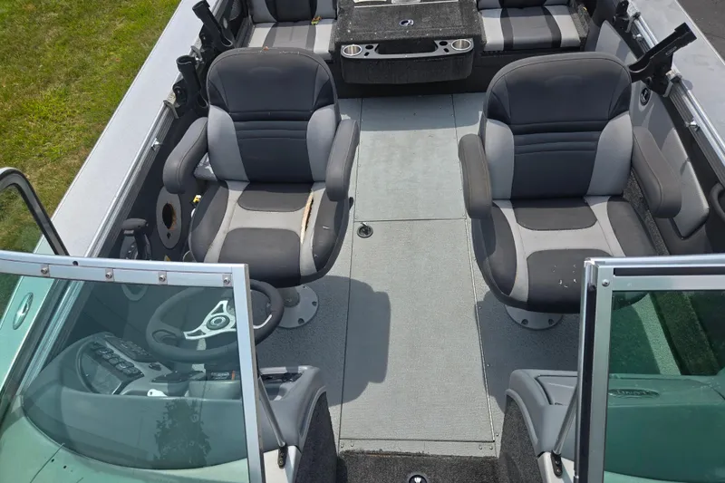 Slide: The Image of 2014 Lund 1900 Tyee boat interior with dual seats and steering console. - 25