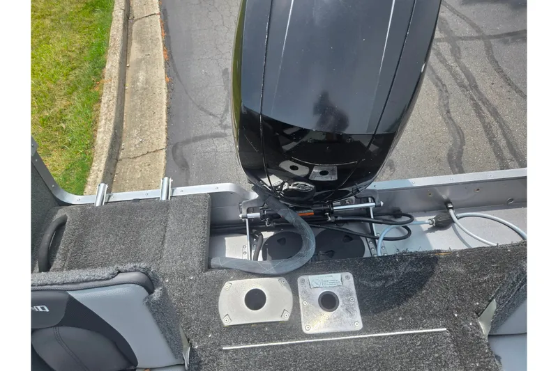 Slide: The Image of 2014 Lund 1900 Tyee boat with outboard motor, viewed from above. - 28