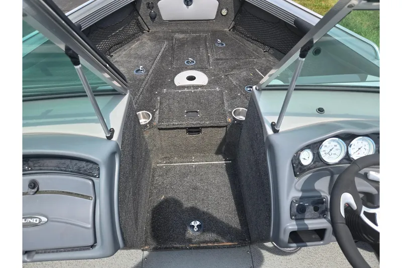 Slide: The Image of Interior view of 2014 Lund 1900 Tyee boat, featuring dashboard and seating area. - 17