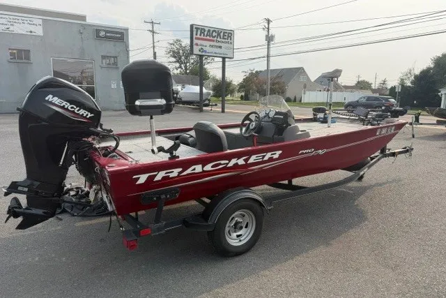 The Image of 2020 Tracker Pro 170 boat with Mercury engine on trailer, parked outdoors. - 1