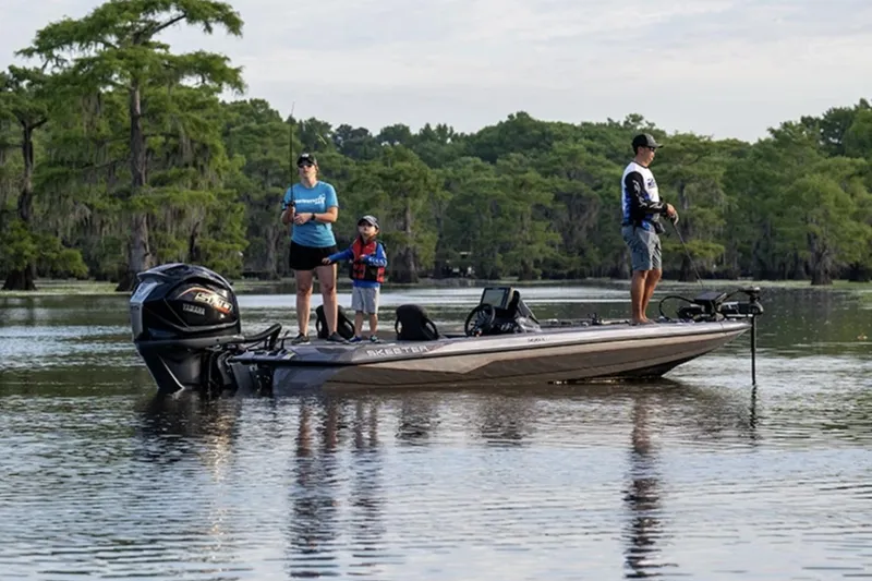 Slide: The Image of Manufacturer Provided Image: Family fishing on a 2025 Skeeter ZXR19 boat in a serene lake setting. - 17