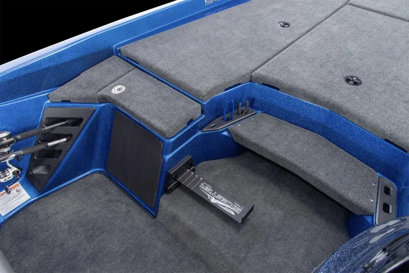 Slide: The Image of Manufacturer Provided Image: 2025 Skeeter ZXR19 boat interior with carpeted deck and storage compartments. - 24