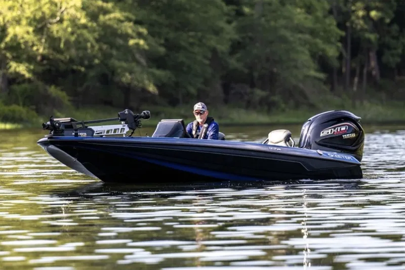 Slide: The Image of Manufacturer Provided Image: 2025 Skeeter ZXR19 boat on a calm lake, surrounded by lush greenery. - 20