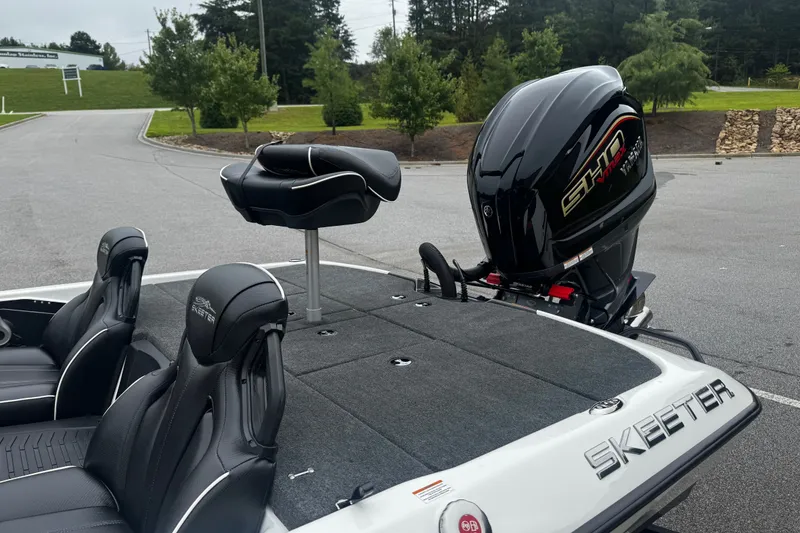 Slide: The Image of 2025 Skeeter ZXR19 boat with sleek seating and powerful outboard motor. - 13