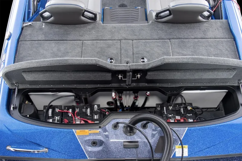 Slide: The Image of Manufacturer Provided Image: 2025 Skeeter ZXR19 boat storage compartment with visible battery setup and wiring. - 28