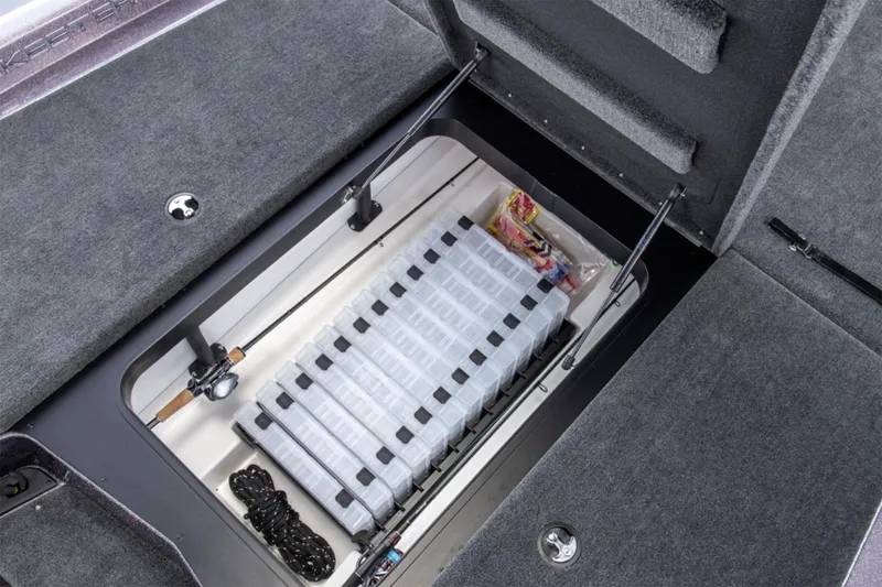Slide: The Image of Manufacturer Provided Image: Storage compartment of 2025 Skeeter ZXR19 boat, featuring organized tackle boxes and fishing gear. - 29