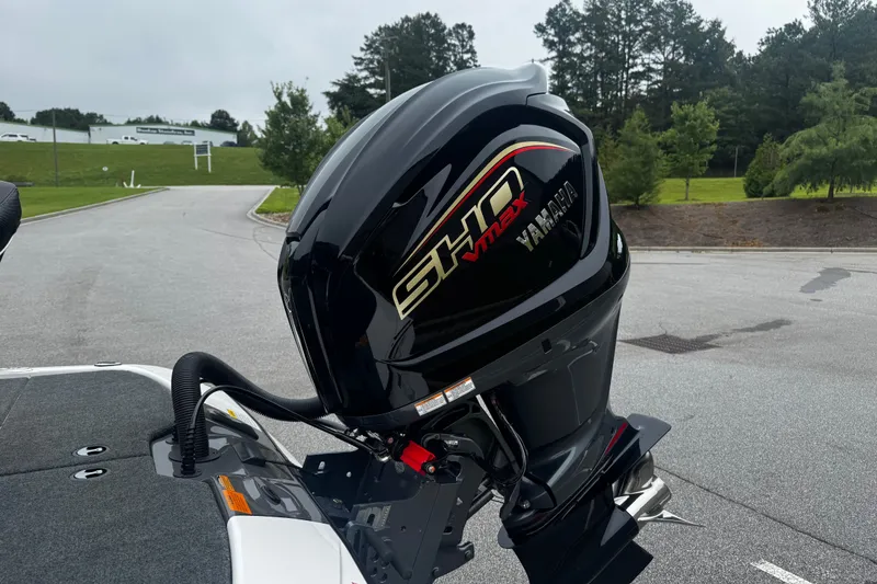 Slide: The Image of 2025 Skeeter ZXR19 boat with Yamaha SHO VMAX engine, parked outdoors. - 14