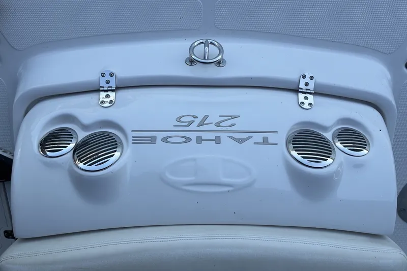 Slide: The Image of Rear view of a 2015 Tahoe 215xi I/O boat with chrome accents. - 14