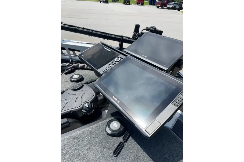 Slide: The Image of 2024 Skeeter ZXR20 boat dashboard with advanced Garmin navigation displays. - 2