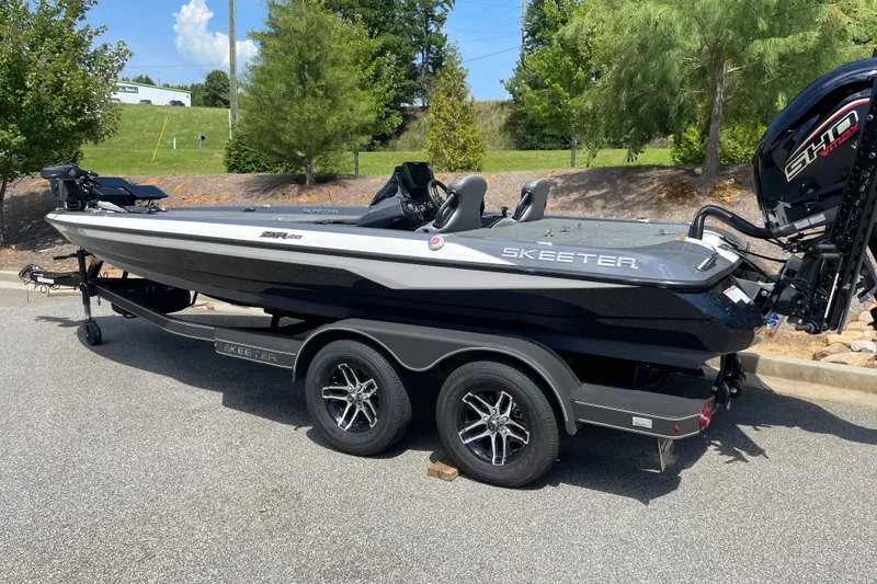 The Image of 2024 Skeeter ZXR20 boat on trailer, parked outdoors, showcasing sleek design and modern features. - 0