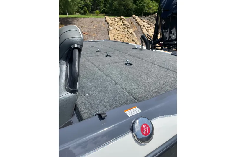 Slide: The Image of 2024 Skeeter ZXR20 boat deck with carpeted surface and seating. - 3