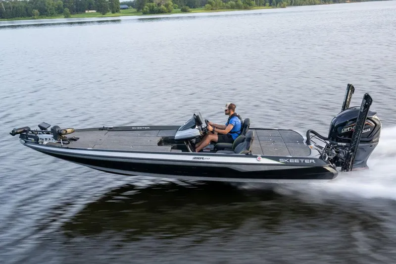 Slide: The Image of Manufacturer Provided Image: 2024 Skeeter ZXR20 boat speeding on a lake with a person at the helm. - 15