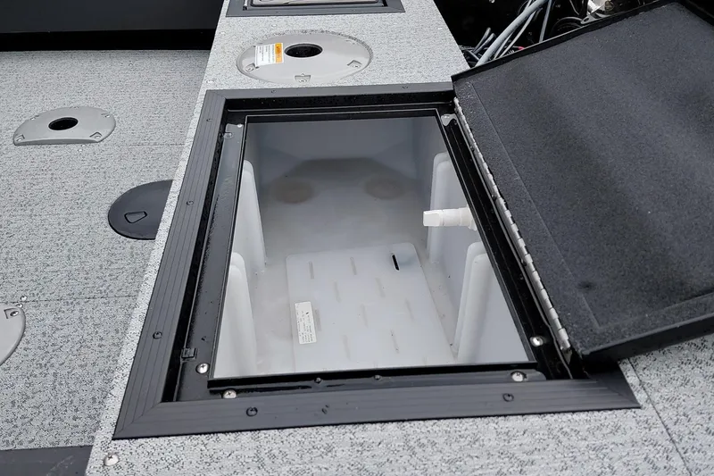 Slide: The Image of Open storage compartment on 2026 Smoker Craft Excursion 166 SC boat deck. - 13