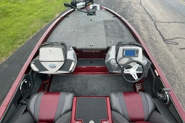 Slide: The Image of 2014 Ranger Z118 boat interior with dual consoles and steering wheel. - 1