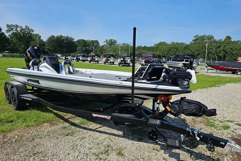 Slide: The Image of 2027 Phoenix 921 Elite X boat on trailer in outdoor setting. - 2