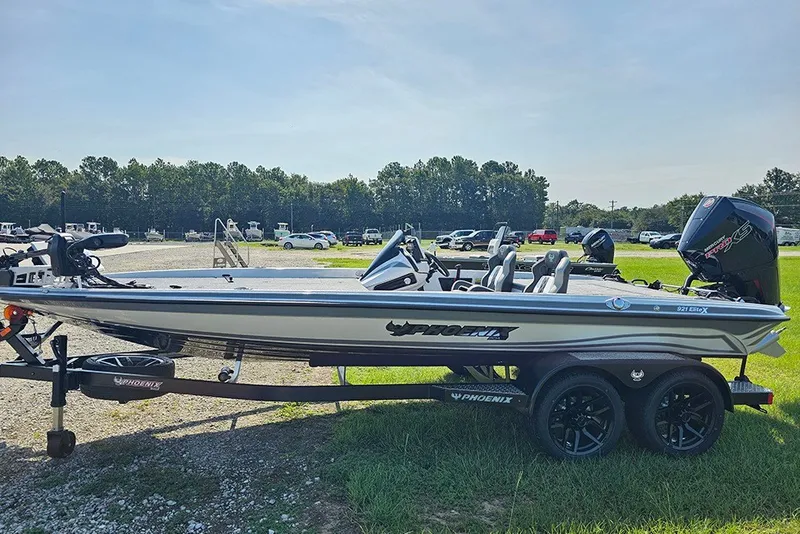 Slide: The Image of 2027 Phoenix 921 Elite X boat on trailer in outdoor setting. - 6