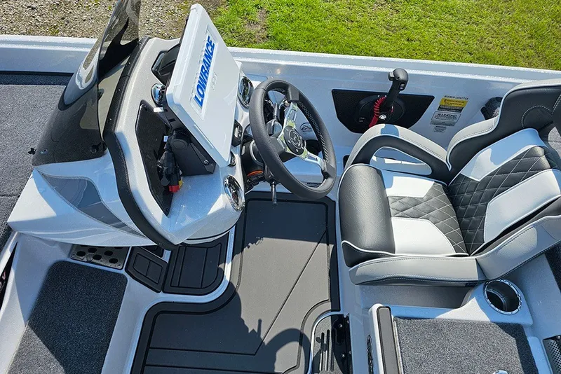 Slide: The Image of Cockpit of 2027 Phoenix 921 Elite X boat with modern steering and seating. - 15