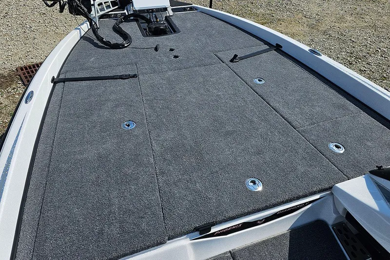 Slide: The Image of 2027 Phoenix 921 Elite X boat deck with gray carpet and storage compartments. - 23