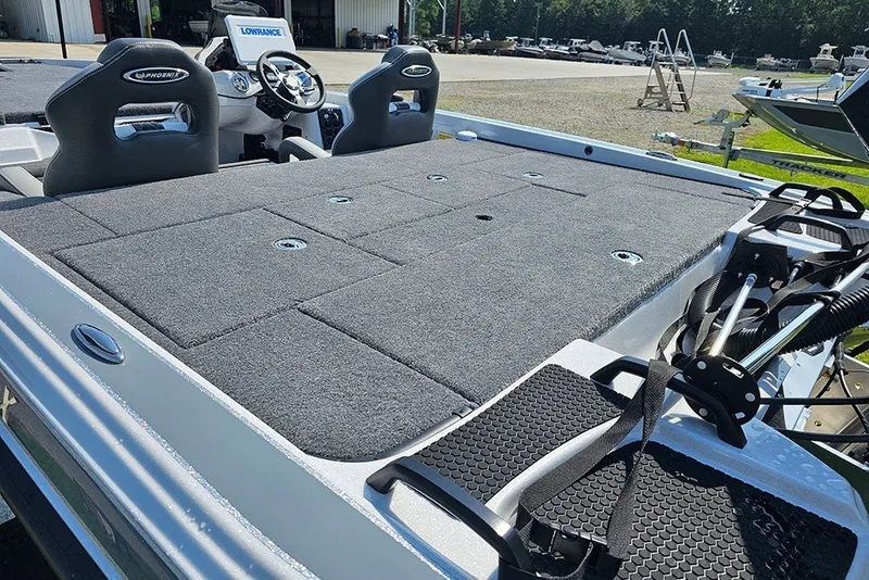 Slide: The Image of 2027 Phoenix 921 Elite X boat with spacious deck and modern seating. - 9