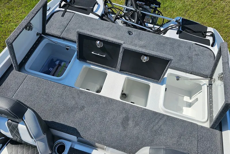 Slide: The Image of 2027 Phoenix 921 Elite X boat storage compartments with open lids, showcasing spacious interior design. - 10