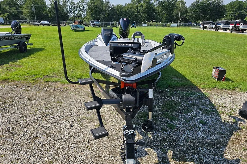 Slide: The Image of 2027 Phoenix 921 Elite X boat with Garmin equipment on a grassy lot. - 4