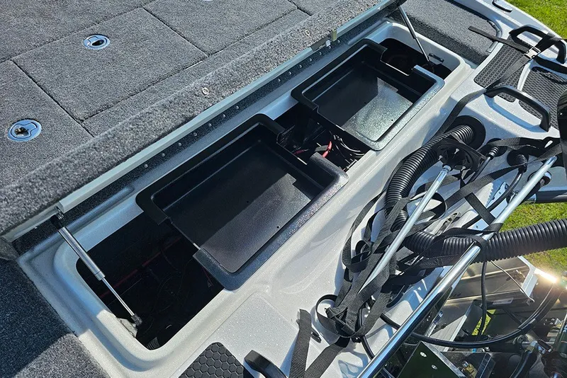 Slide: The Image of Open storage compartments on a 2027 Phoenix 921 Elite X boat deck. - 12