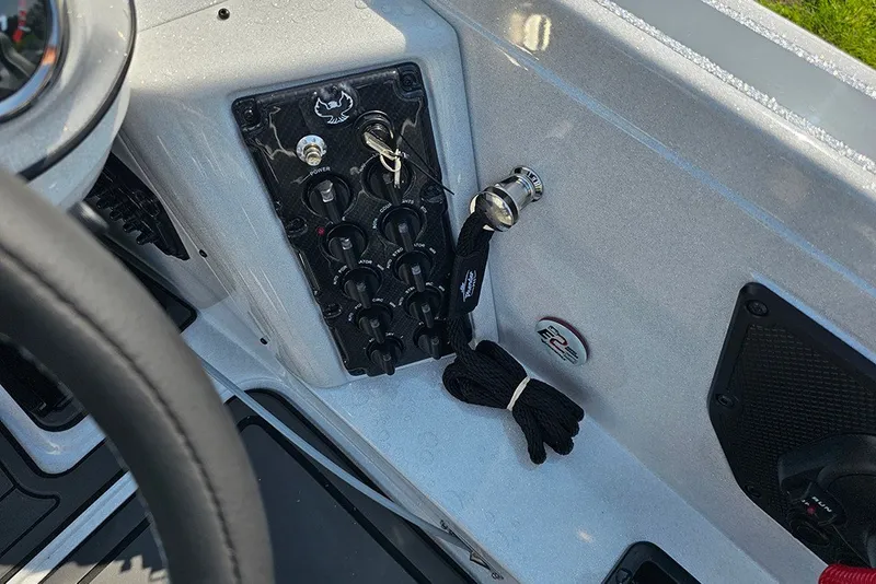 Slide: The Image of 2027 Phoenix 921 Elite X boat dashboard with control panel and accessories. - 28