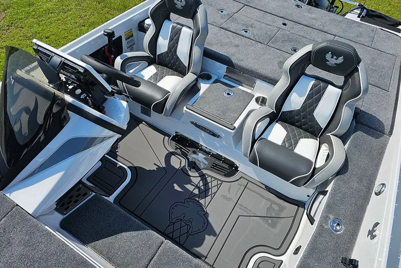Slide: The Image of Interior of 2027 Phoenix 921 Elite X boat with modern seating and dashboard. - 13