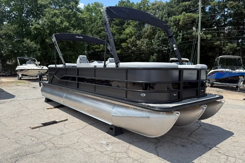 The Image of 2026 Bentley Pontoons Legacy 243 Navigator pontoon boat in outdoor setting. - 0
