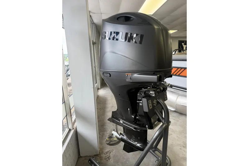 Slide: The Image of Suzuki outboard motor on a 2026 Bentley Pontoons Legacy 243 Navigator. - 18