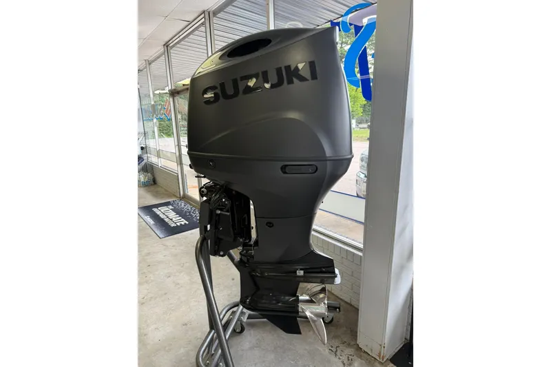 Slide: The Image of Suzuki outboard motor displayed indoors, compatible with 2026 Bentley Pontoons Legacy 243 Navigator. - 19