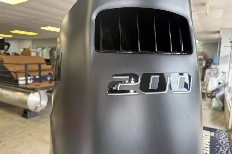 Slide: The Image of Close-up of a 200 horsepower engine on a 2026 Bentley Pontoons Legacy 243 Navigator. - 17