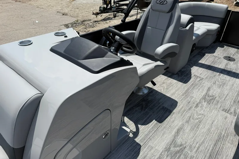 Slide: The Image of 2026 Bentley Pontoons Legacy 243 Navigator interior with sleek seating and modern console design. - 4