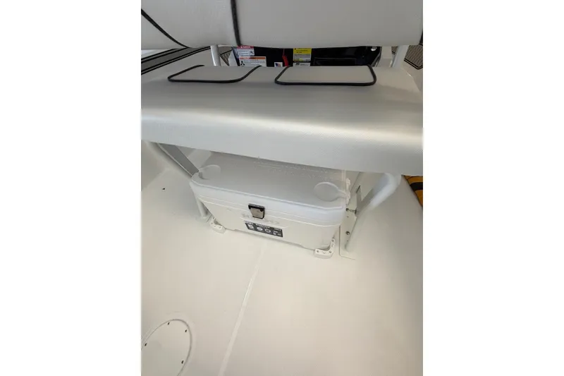 Slide: The Image of Interior view of 2027 Wellcraft 202 Fisherman boat, featuring a storage compartment. - 22