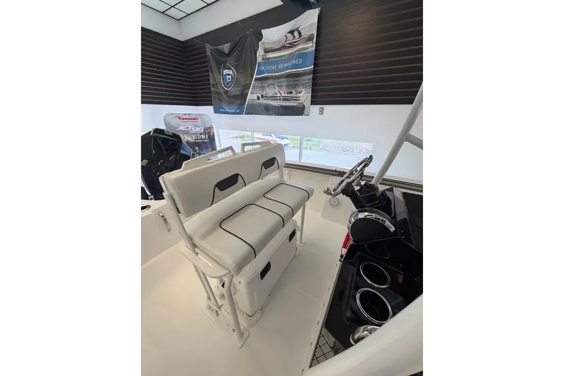 Slide: The Image of 2027 Wellcraft 202 Fisherman boat interior with seating and steering console. - 14