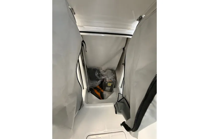 Slide: The Image of Interior storage compartment of 2027 Wellcraft 202 Fisherman boat, featuring organized space. - 20