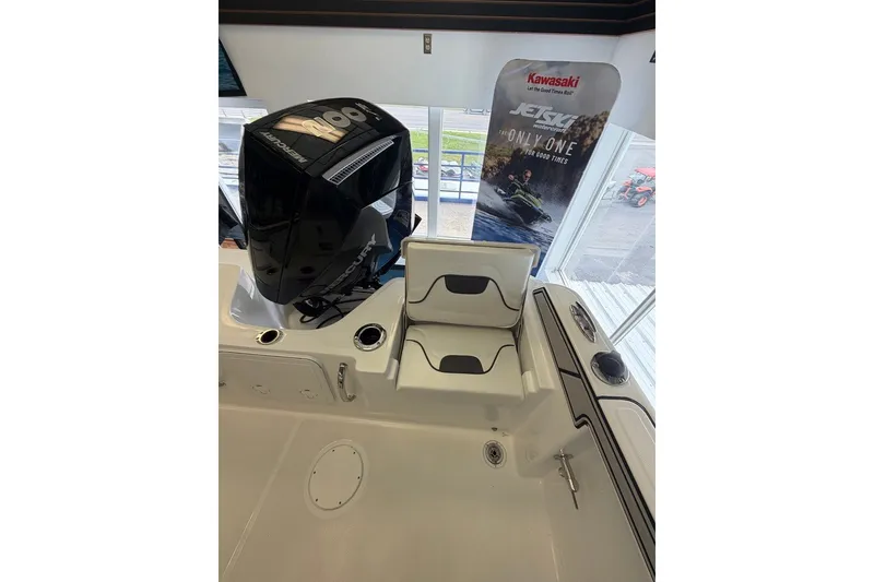 Slide: The Image of 2027 Wellcraft 202 Fisherman boat interior with Mercury engine and seating area. - 9