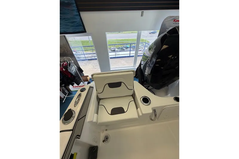 Slide: The Image of 2027 Wellcraft 202 Fisherman boat interior with seating and engine view. - 12