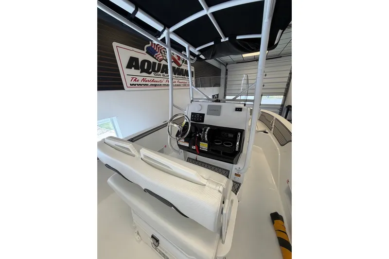 Slide: The Image of 2027 Wellcraft 202 Fisherman boat interior with steering console and seating. - 11