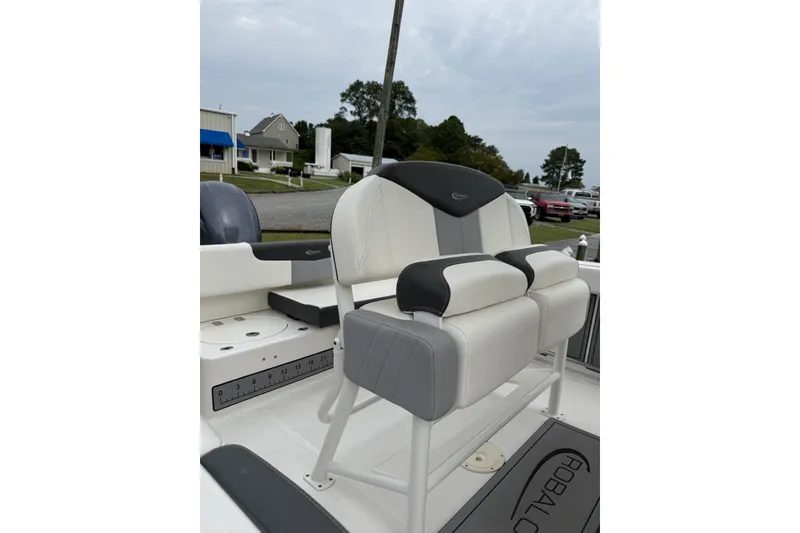 Slide: The Image of 2022 Robalo R222 Center Console boat seat with gray and white upholstery. - 3