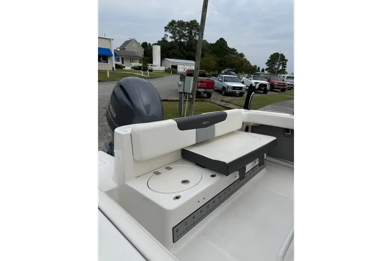 Slide: The Image of 2022 Robalo R222 Center Console boat with Yamaha engine, featuring a rear seating area. - 4