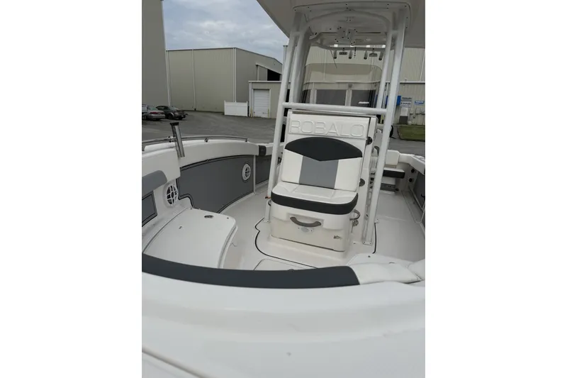 Slide: The Image of 2022 Robalo R222 Center Console boat interior with seating and storage. - 6